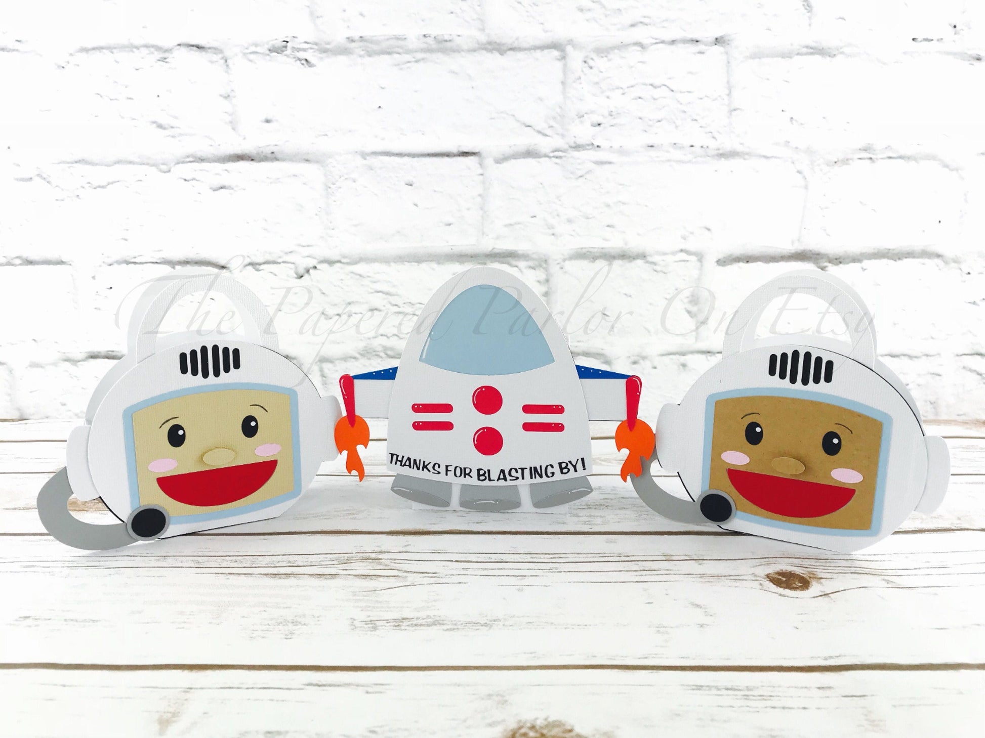 Astronaut party boxes. Cute space party boxes that are displayed as a astronaut or as a rocket ship.