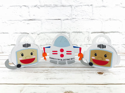 Astronaut party boxes. Cute space party boxes that are displayed as a astronaut or as a rocket ship.