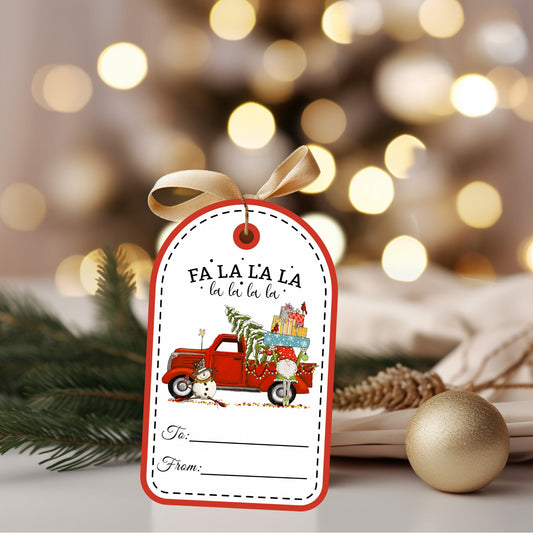 A dome shaped Christmas hanging gift tag featuring a vintage red pickup truck with a sitting snowman and gnome holding a stack of gifts.